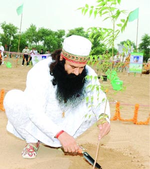 Revered Guruji planting sapling